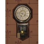 AN AMERICAN PENDULUM WALL CLOCK, mahogany cased with circular dial having Roman numerals