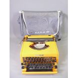 THIS LOT IS PART OF THE CONSIGNMENT FROM BODELWYDDAN CASTLE RETRO TYPEWRITER - an orange plastic