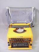 THIS LOT IS PART OF THE CONSIGNMENT FROM BODELWYDDAN CASTLE RETRO TYPEWRITER - an orange plastic