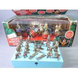 VINTAGE TOYS - a quantity of cast soldiers and a boxed 'Santa's marching band'