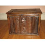 LATE 18TH CENTURY OAK COFFER having an inset lid to the top and with four narrow carved panels and a