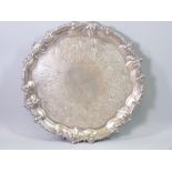 A SILVER SALVER on three scroll supports with latticed and floral decoration, not inscribed, 31cms