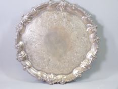 A SILVER SALVER on three scroll supports with latticed and floral decoration, not inscribed, 31cms