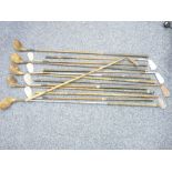 OLD GOLF CLUBS - a large parcel of wooden and sudo wood shafted golf irons and woods