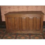 LATE 18TH CENTURY OAK DOWER CHEST having a four panel lid over a base having five narrow fielded