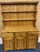 MODERN PINE DRESSER with two shelf shaped rack over a base section of three frieze drawers and