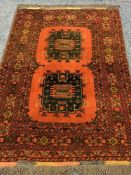 EASTERN TYPE WOOLLEN RED GROUND CARPET having double central block pattern and multi-bordered edge