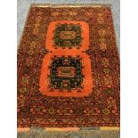 EASTERN TYPE WOOLLEN RED GROUND CARPET having double central block pattern and multi-bordered edge