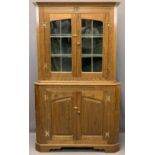 REPRODUCTION OAK TWO PIECE CORNER CUPBOARD, the twin upper doors with leaded detail to the glass and