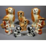 STAFFORDSHIRE POTTERY DOGS GROUP, three pairs and two others including a pair of red and white