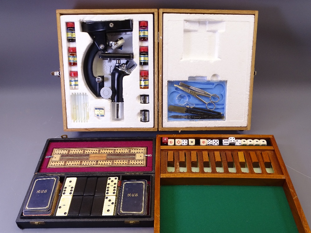 MICROSCOPE IN A WOODEN CASE WITH ACCESSORIES, dominoes and cribbage cased set and a Mah-jong set