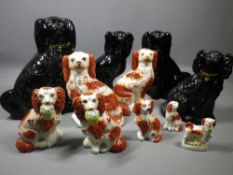 STAFFORDSHIRE POTTERY SEATED SPANIELS, a mixed group including a gilt highlighted pair of