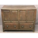 ANTIQUE OAK MULE CHEST with lift-off braced lid over a four panel front and two lower drawers with