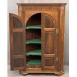 REGENCY MAHOGANY TWO DOOR WALL HANGING CORNER CUPBOARD, the twin arched six panel doors with brass H