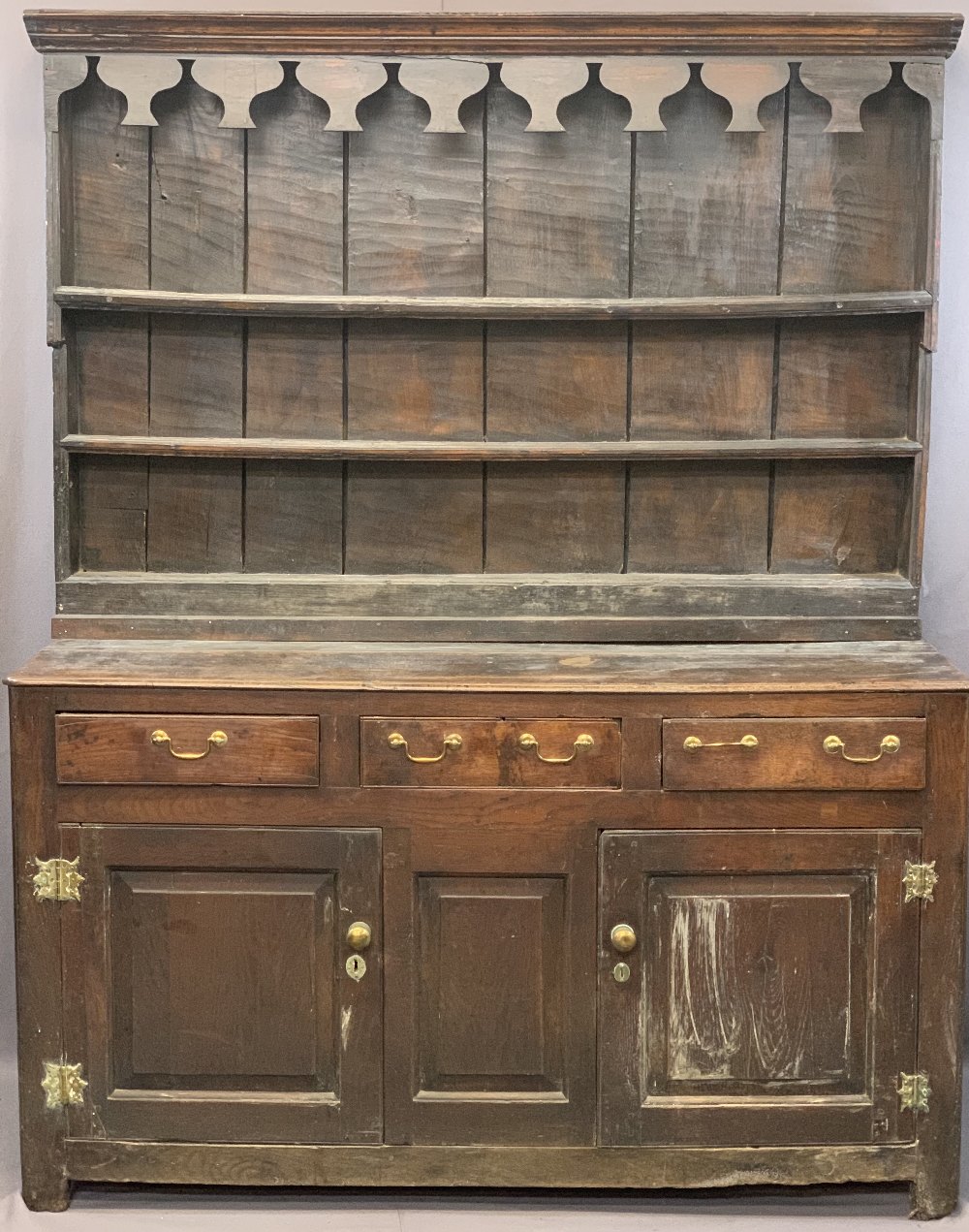 CIRCA 1760 WELSH OAK DRESSER having a three shelf stepped rack with thick backboards and later