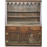 CIRCA 1760 WELSH OAK DRESSER having a three shelf stepped rack with thick backboards and later