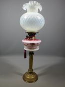 VINTAGE BRASS BASED OIL LAMP with tonal pink decorative glass font and reproduction Vaseline