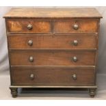 MID 19TH CENTURY MAHOGANY CHEST of two short over three long drawers with turned wooden knobs on bun
