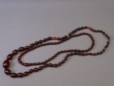 TWO CHERRY AMBER BAKELITE NECKLACES, 79grms the larger, 29grms the smaller