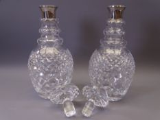 SILVER BANDED GLASS DECANTERS, A PAIR, 39.5cms tall, marked (only one visible) 'I F & Son Ltd',