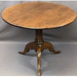 ANTIQUE OAK CIRCULAR TRIPOD TILT-TOP TABLE, the 91.5cms diameter top on a turned column base and