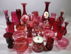 CRANBERRY & RUBY GLASS COLLECTION OF JUGS, decanters, bowls, vases and drinking glassware, 30 plus