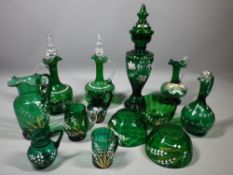 ENAMEL PAINTED VICTORIAN GREEN GLASSWARE, 13 pieces to include a pair of decanters with stoppers,