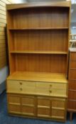 MID-CENTURY NATHAN TEAK SIDE CABINET, shelved top above base fitted four-frieze drawers and panelled