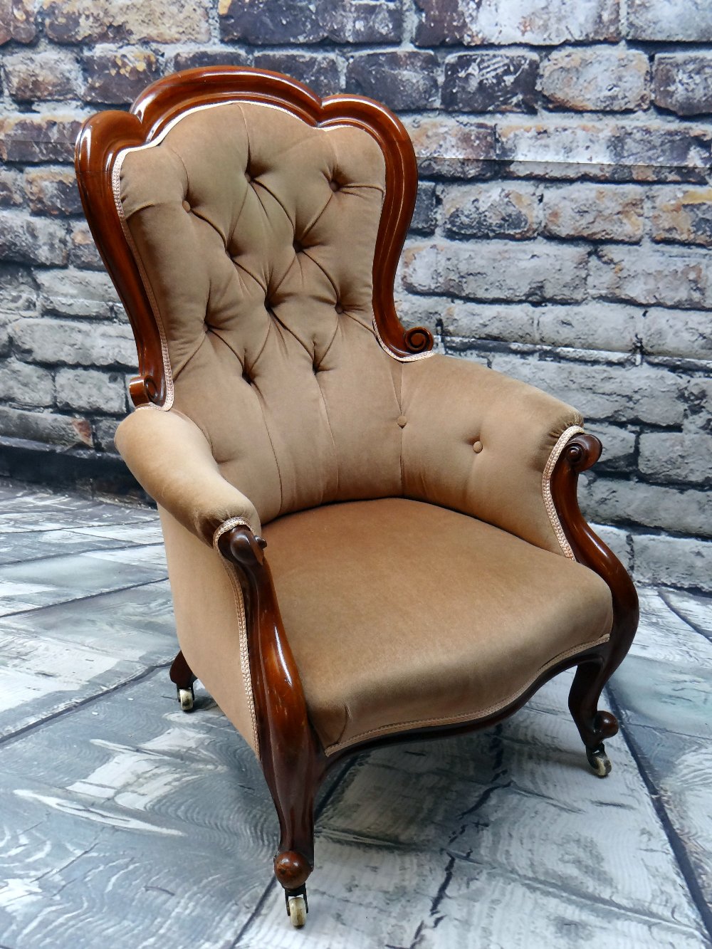 VICTORIAN WALNUT ARMCHAIR, button upholstered back, padded arms and stuffover serpentine seat,