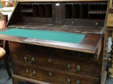 GEORGE III MAHOGANY BUREAU, angled fall and fitted interior above four graduated long drawers