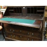 GEORGE III MAHOGANY BUREAU, angled fall and fitted interior above four graduated long drawers