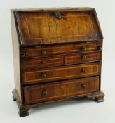 GEORGE II-STYLE MINIATURE WALNUT AND BOXWOOD STRUNG BUREAU, angled fall and fitted interior on