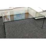 ATTRIBUTED TO LIGNE-ROSET FOR HEALS: A 'PONT' GLASS COFFEE TABLE, single sheet of moulded glass,