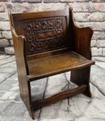 17TH CENTURY-STYLE CARVED OAK CHAIR, with boarded sides and carved panel back, 59cms wide