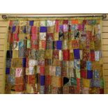 INDIAN PATCHWORK DRAPE, comprised of Rajasthani embroidered textile squares, many from wedding