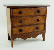 VICTORIAN MINIATURE WALNUT CHEST, fitted three long drawers over shaped apron, high bracket feet, 30