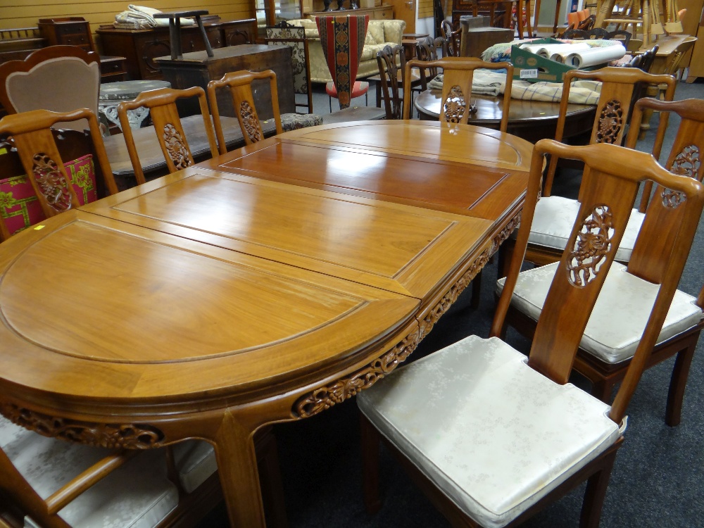 MODERN CHINESE HARDWOOD EXTENDING OVAL DINING TABLE & EIGHT CHAIRS, table with panelled top and