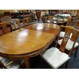 MODERN CHINESE HARDWOOD EXTENDING OVAL DINING TABLE & EIGHT CHAIRS, table with panelled top and