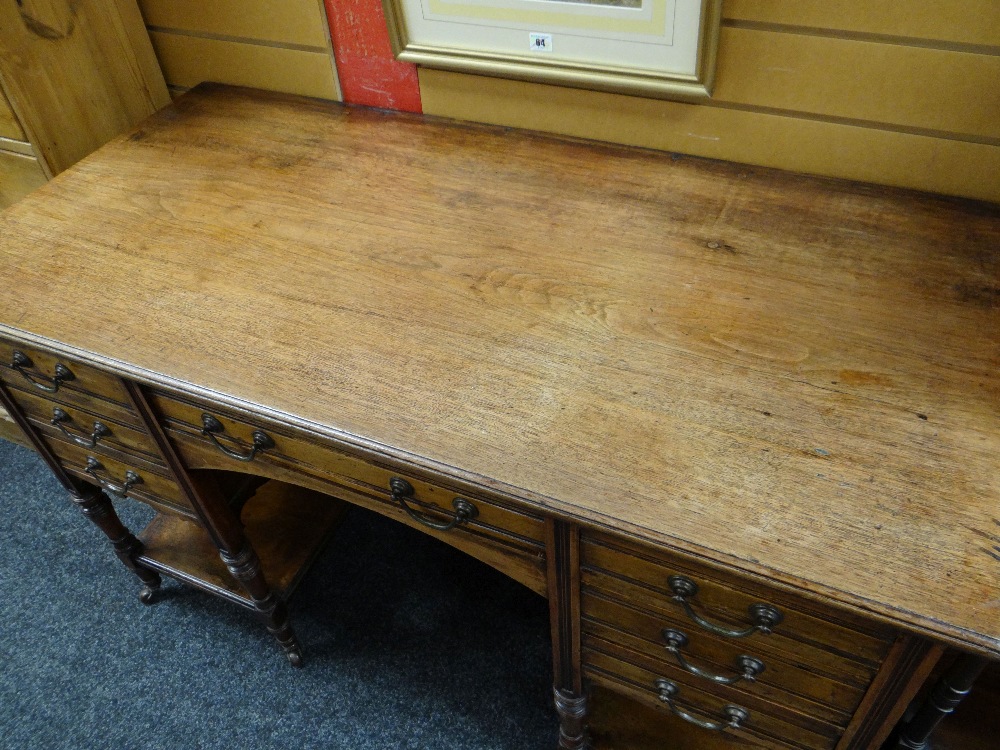 LATE VICTORIAN MAHOGANY KNEEHOLE DESK, fitted seven drawers on turned legs, tied by platform - Image 2 of 2