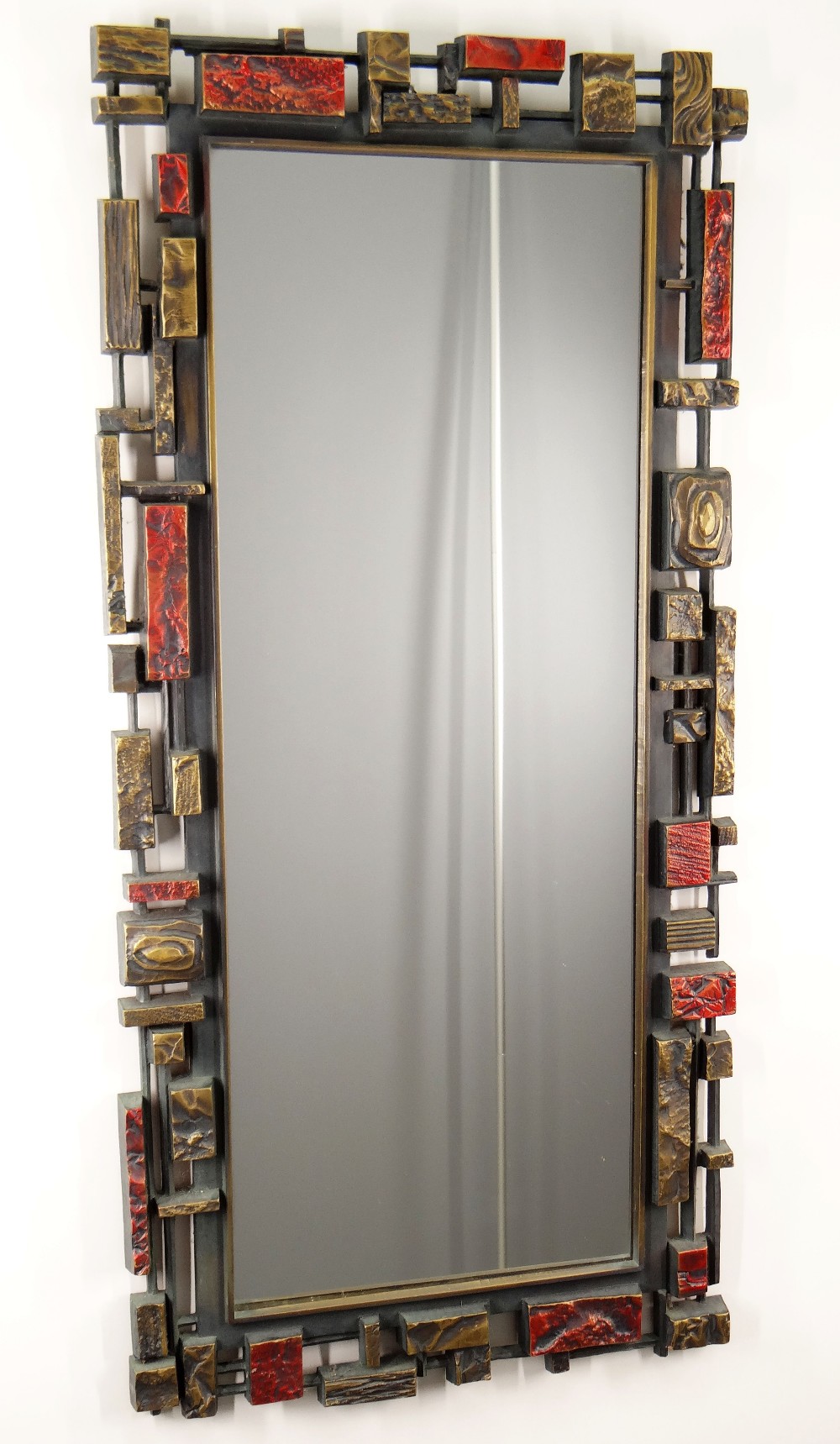 SYROCO: BRUTALIST MOULDED AMERICAN WALL MIRROR, c. 1970s, coloured in dark metalic tones, reverse