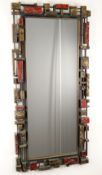 SYROCO: BRUTALIST MOULDED AMERICAN WALL MIRROR, c. 1970s, coloured in dark metalic tones, reverse