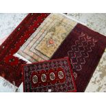 FOUR SMALL AFGHAN-STYLE RUGS (4)