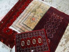 FOUR SMALL AFGHAN-STYLE RUGS (4)