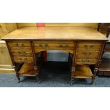 LATE VICTORIAN MAHOGANY KNEEHOLE DESK, fitted seven drawers on turned legs, tied by platform