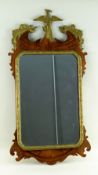 GEORGE III-STYLE PARCEL GILT MAHOGANY FRET MIRROR, with Ho-Ho bird and rocaille surmount, and cut