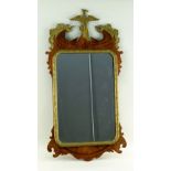 GEORGE III-STYLE PARCEL GILT MAHOGANY FRET MIRROR, with Ho-Ho bird and rocaille surmount, and cut