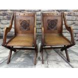 PAIR OF ARTS & CRAFTS OAK GLASTONBURY CHAIRS, square panelled backs carved with flowering lily