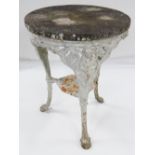 ANTIQUE CAST IRON GARDEN TABLE, with marble top (weathered), 59cms diam.