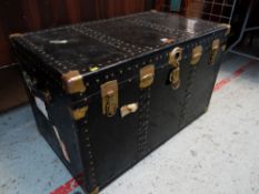 VINTAGE STEAMER TRUNK with brass plated locks and corner clasps, leather handles