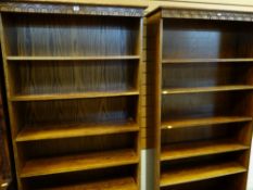 PAIR OF TALL CARVED PINE BOOKCASES, with adjustable shelves (2)